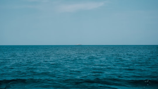 body of water under white sky during daytime in Bangka-Belitung Indonesia