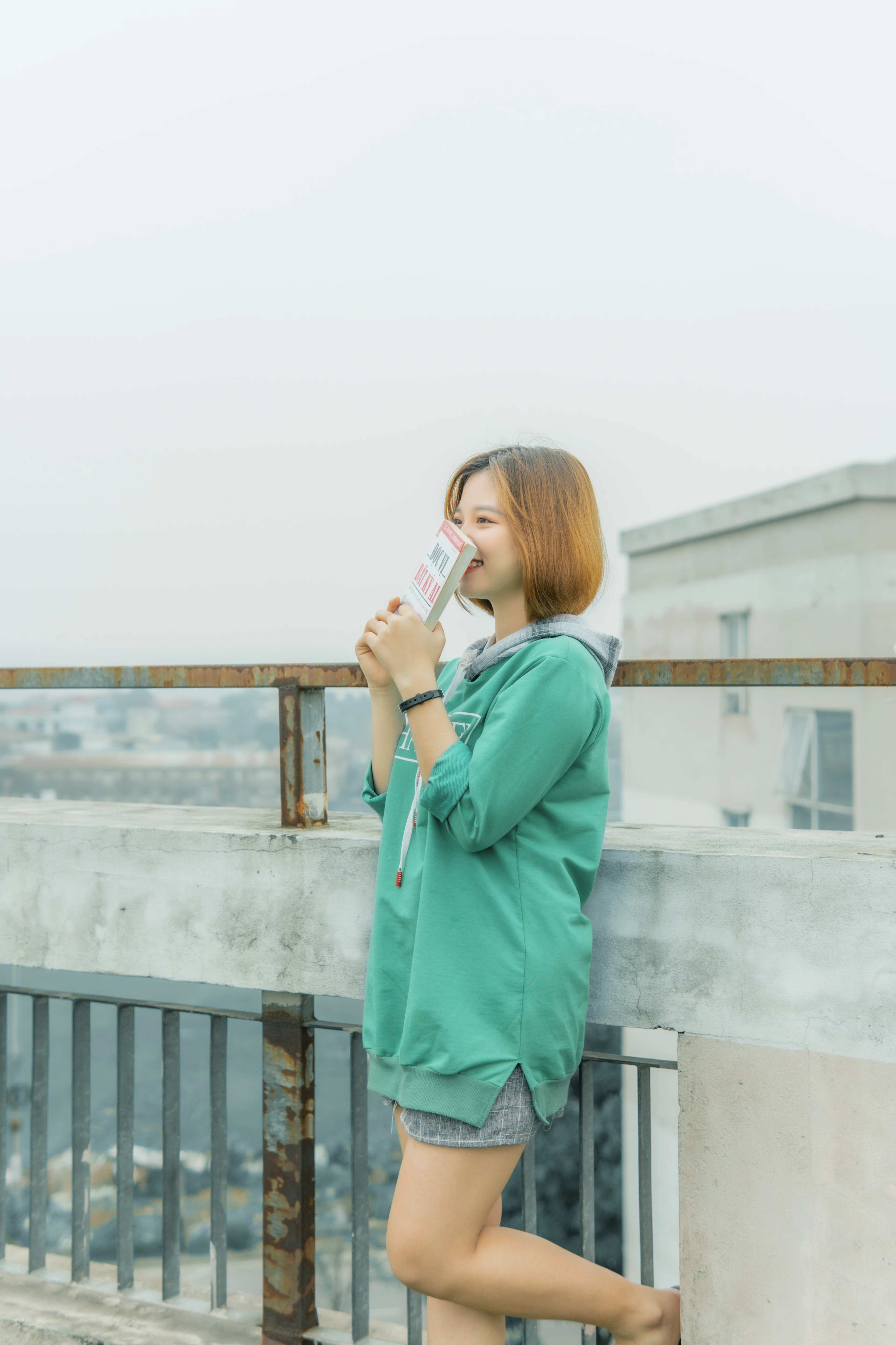 Guest drinking water on a sunny balcony