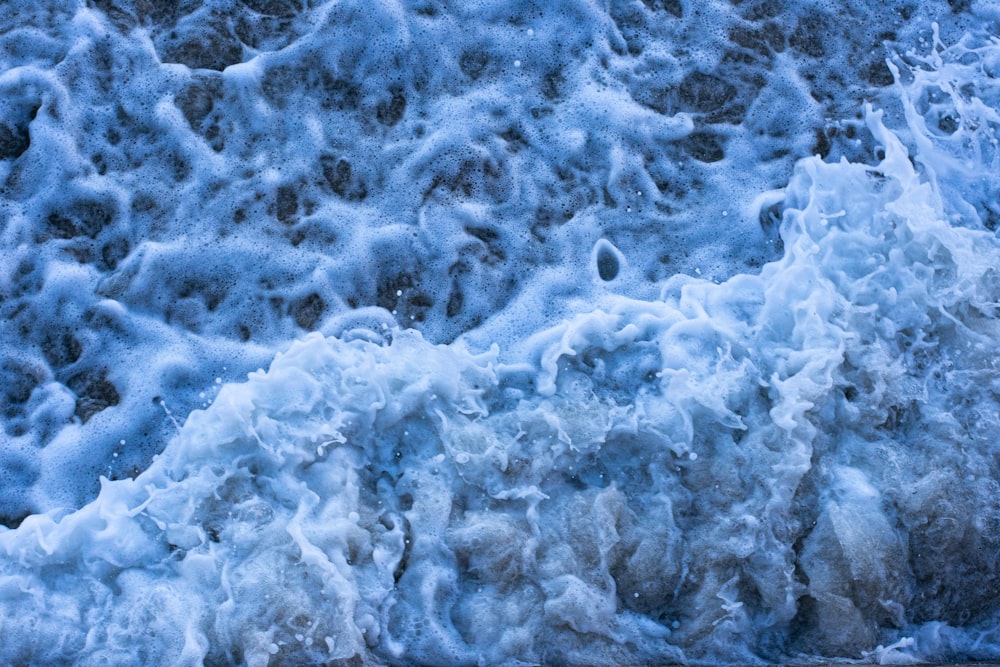 white and blue ocean waves