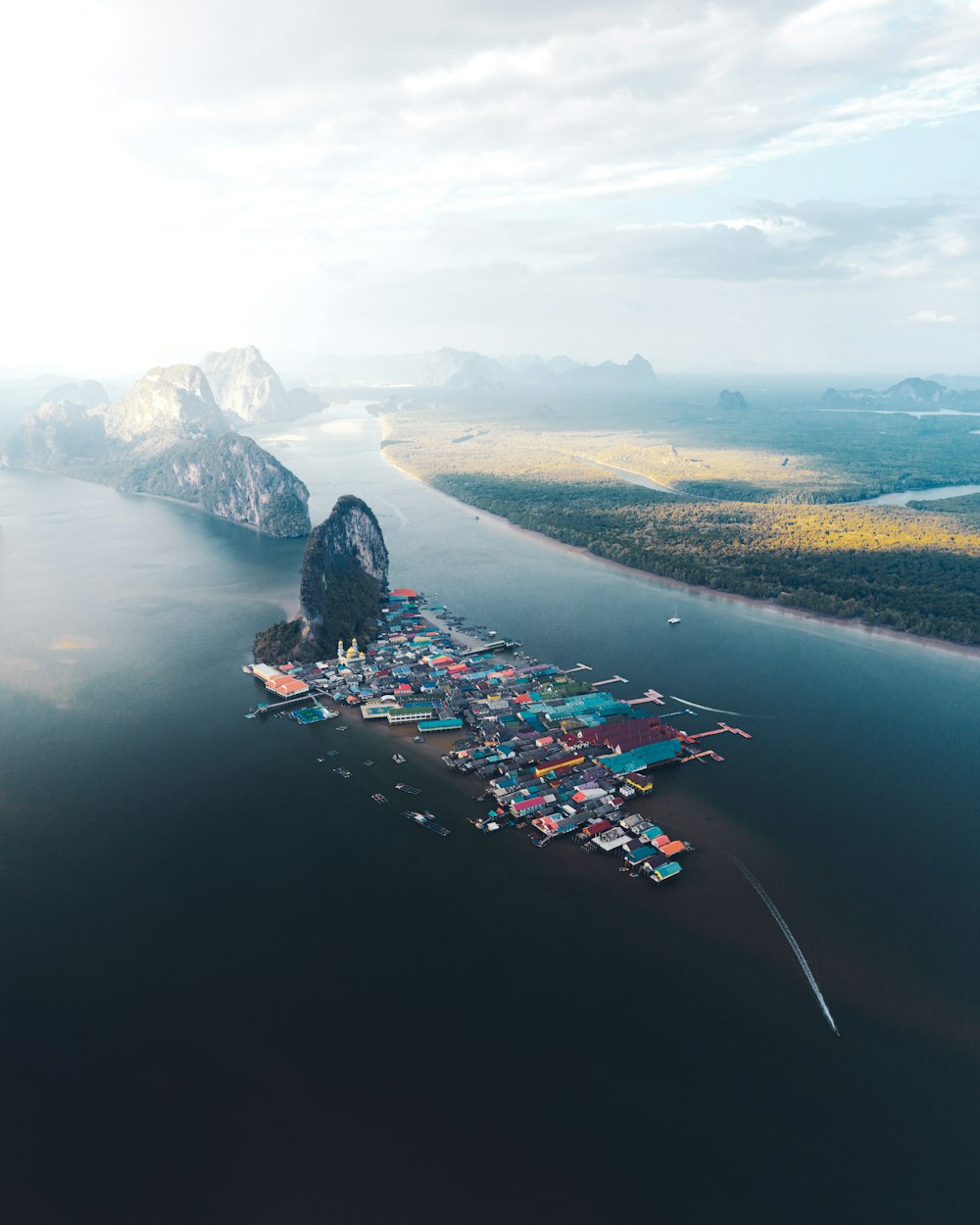 aerial view of city near body of water during daytime