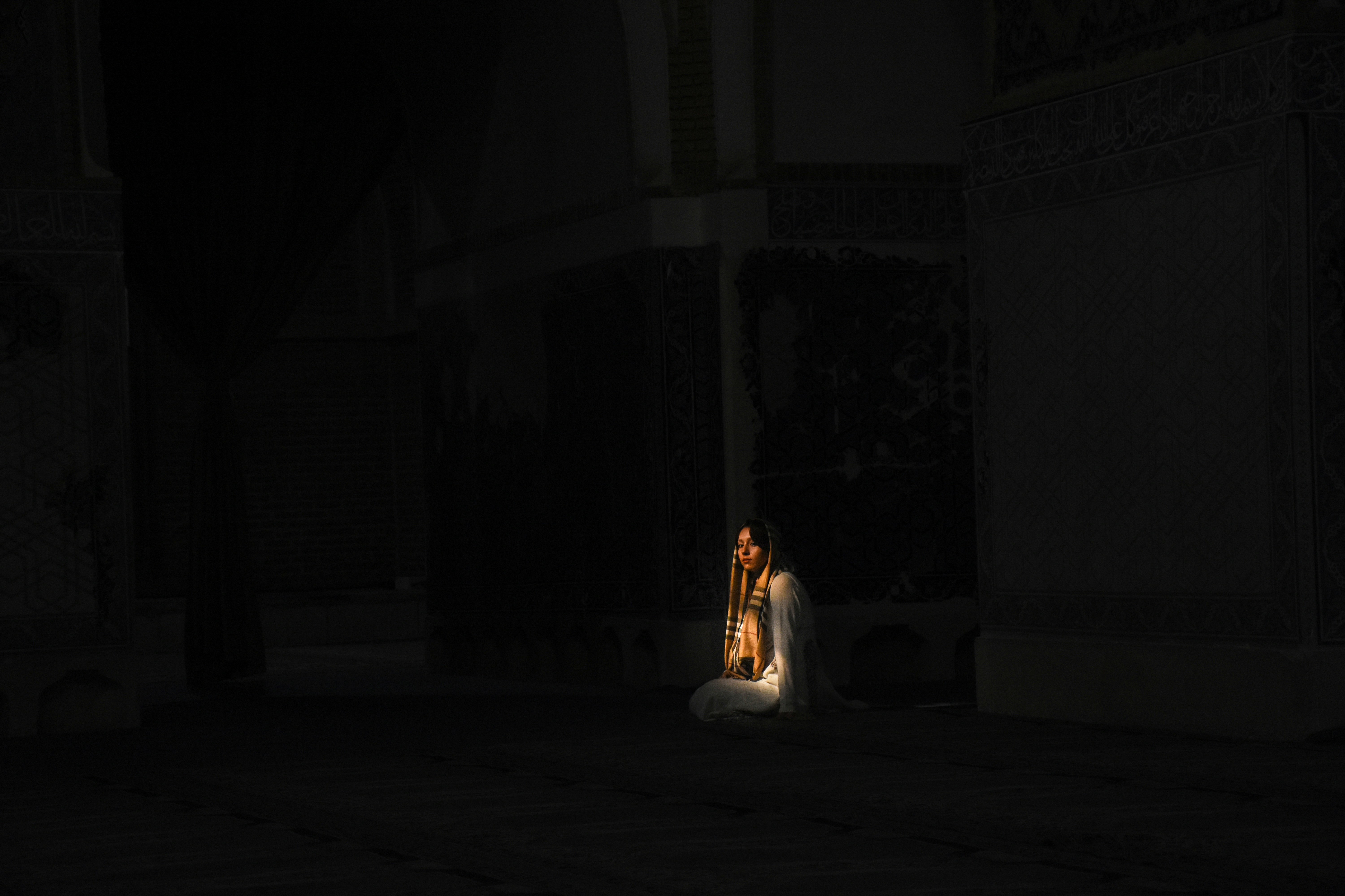 woman in white dress sitting on floor