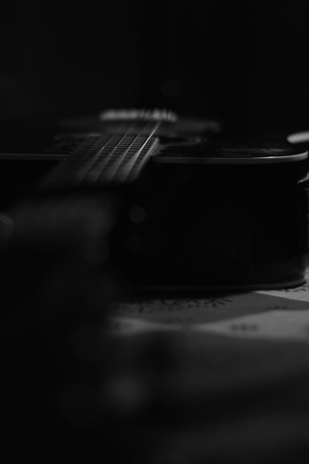 grayscale photo of guitar head stock