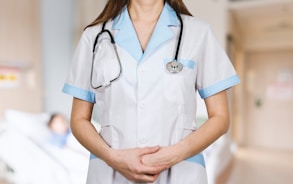 nursing student in white button up shirt and blue stethoscope