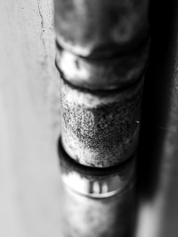 Close-up of a steel pipe with diameter 90mm, highlighting its texture and strength.