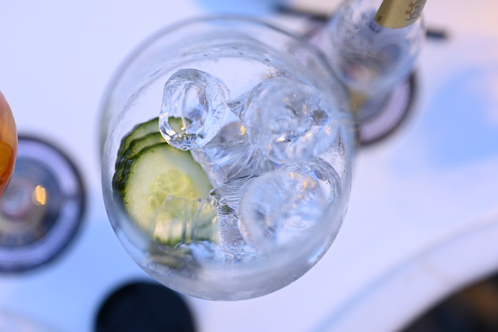 clear glass bottle with water