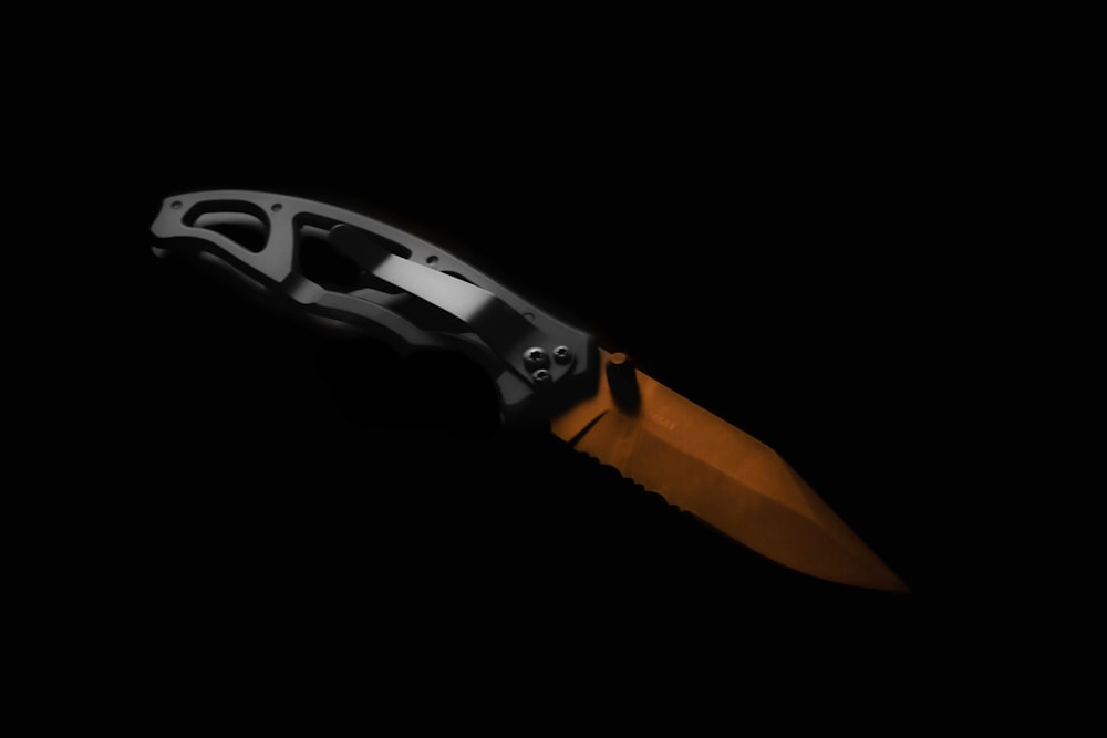 black and orange handle pocket knife