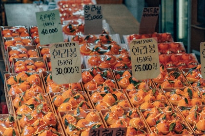 orange fruits on display in store