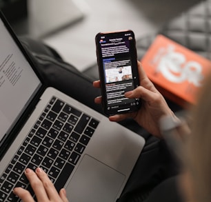 person holding black iphone 4