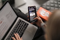 person holding black iphone 4
