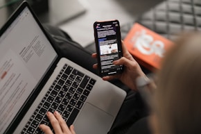 person holding black iphone 4