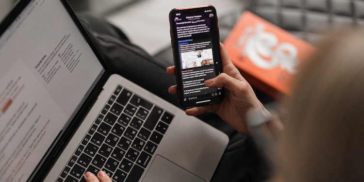 person holding black iphone 4