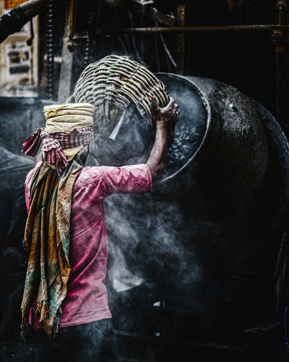 woman in red and yellow sari dress holding brown wicker basket