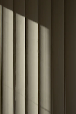 Detail of smooth siding panels with sharp edges highlighting craftsmanship.