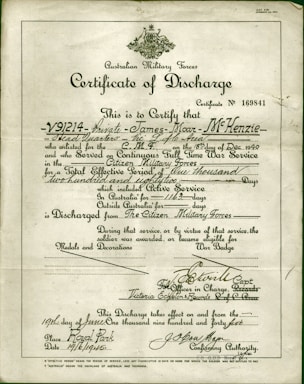 A formal document titled 'Certificate of Discharge' from the Australian Military Forces. It contains printed and handwritten text certifying the discharge of a private, along with dates, service details, and signatures. The background is a light, aged paper, with a green border and an emblem at the top center.