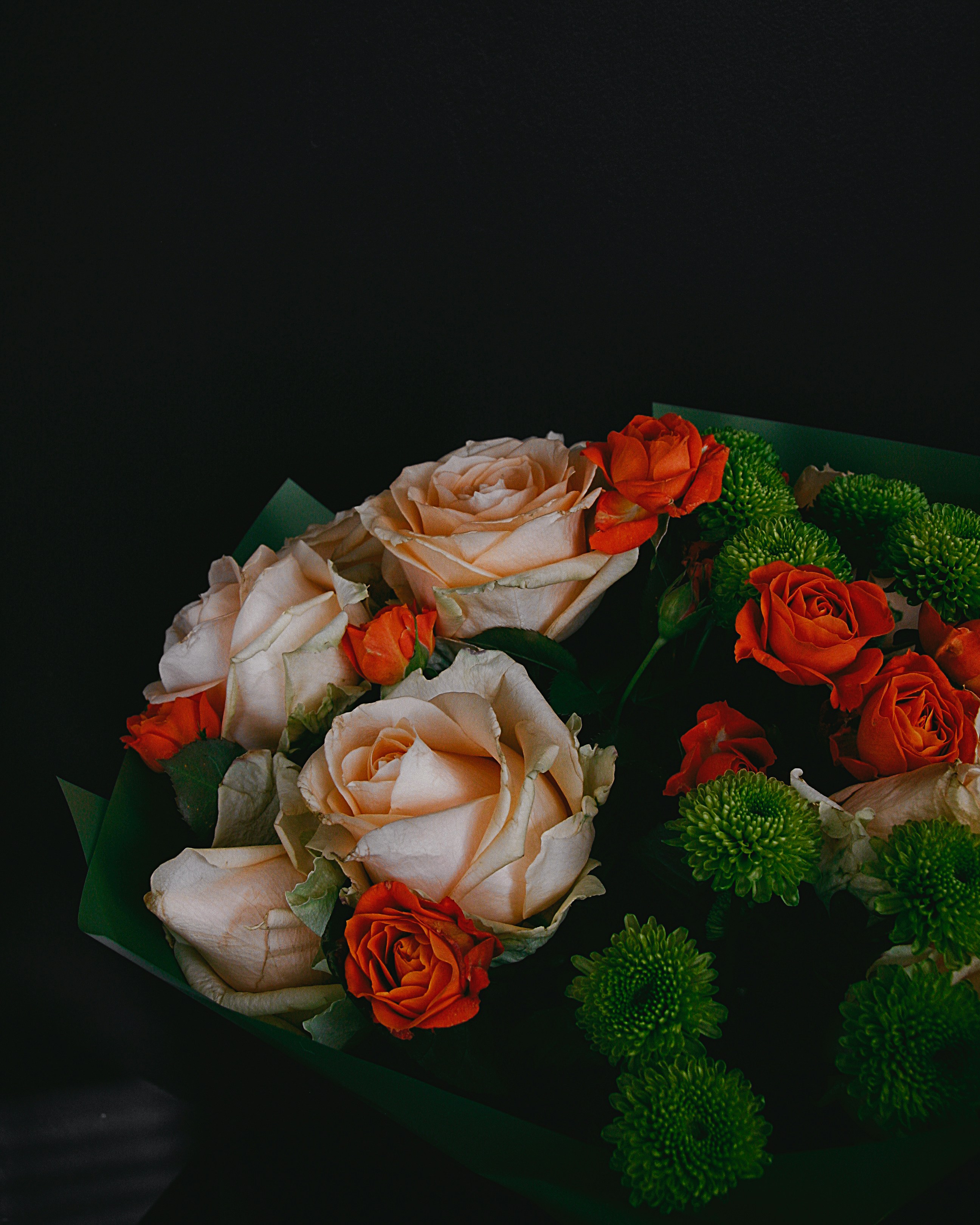 Bouquet of cream roses on black