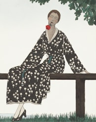 woman in black and white floral robe sitting on brown wooden bench