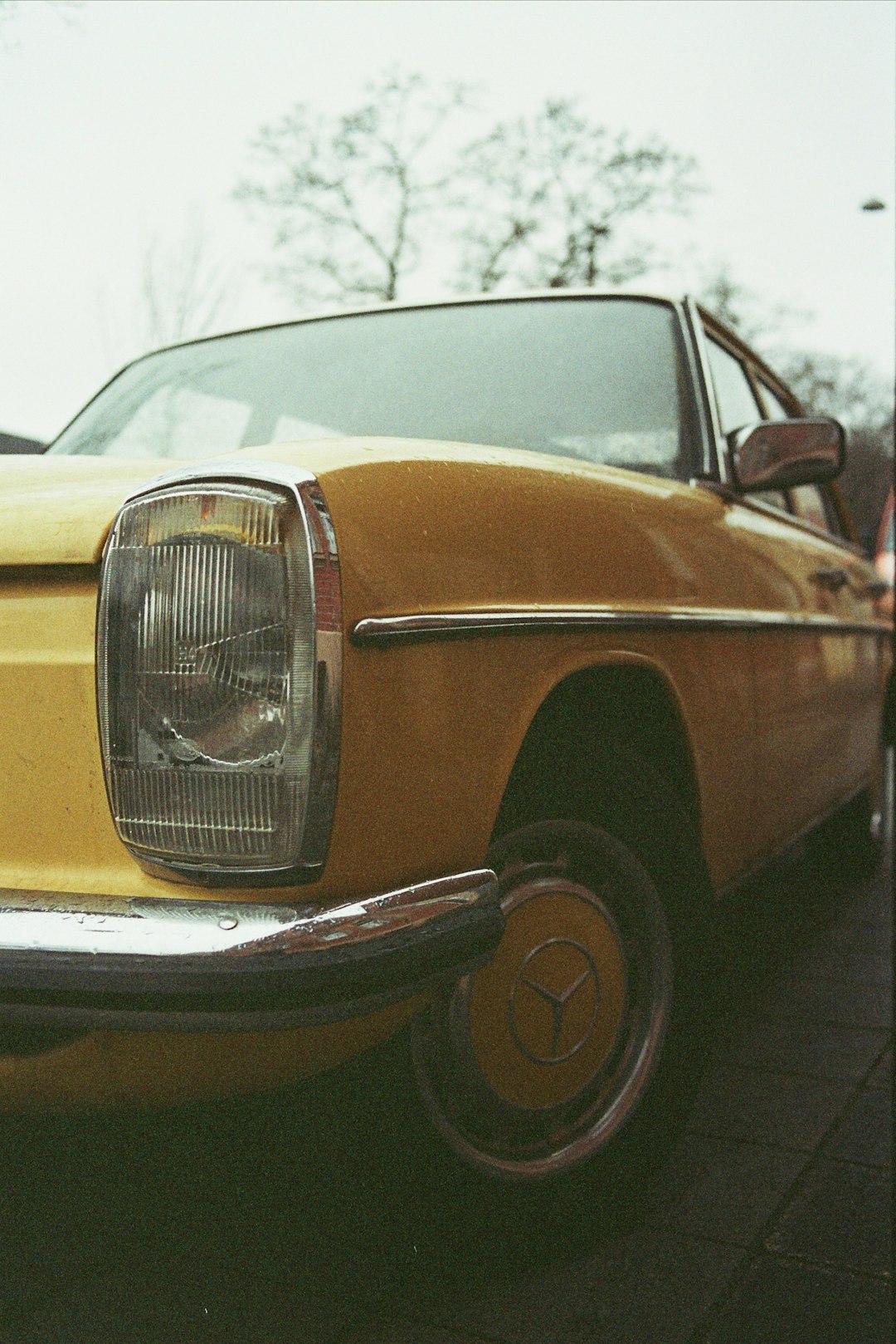 yellow and black car on gray pavement