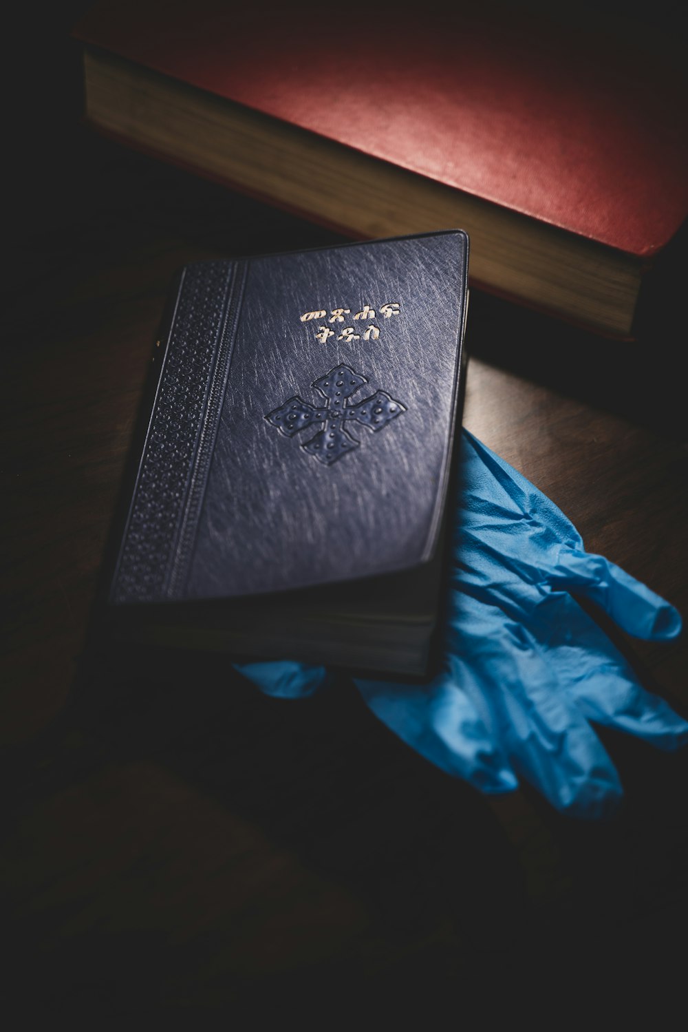 black book on brown wooden table