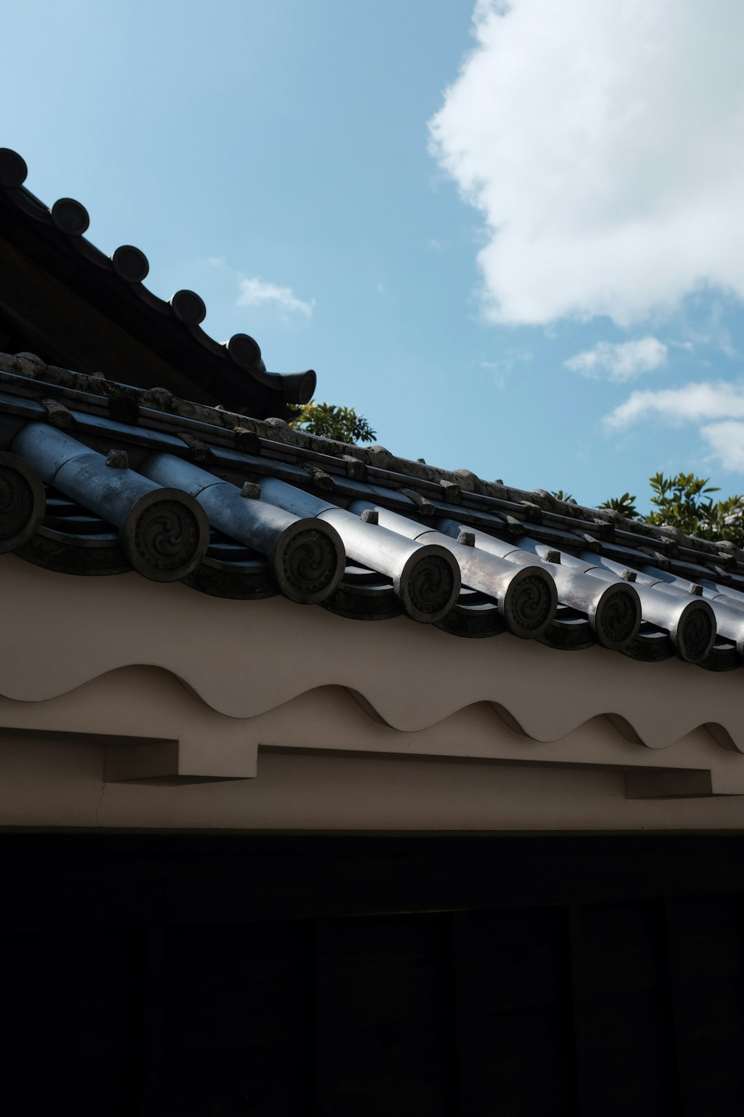 brown roof tiles under blue sky during daytime