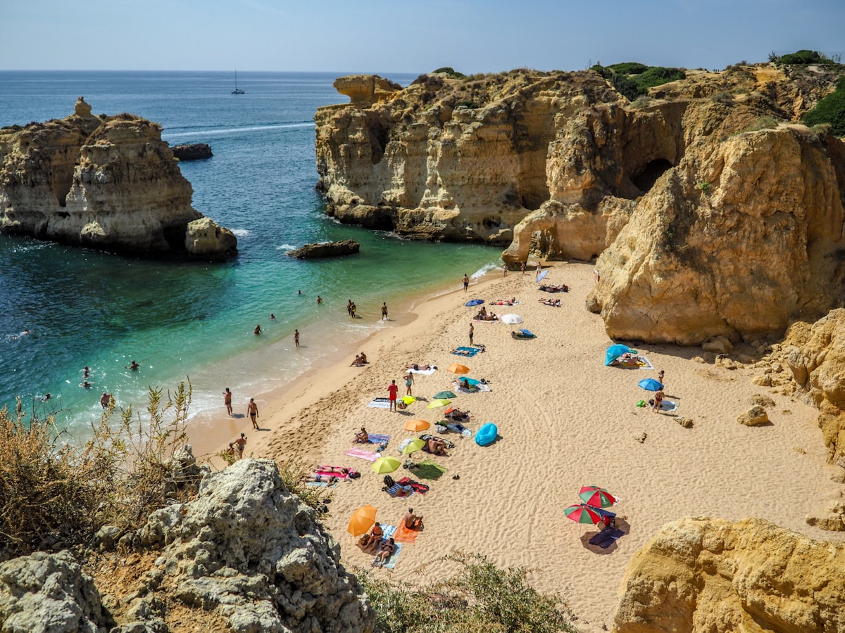 Beach essentials on sand for a day at a secluded Algarve beach