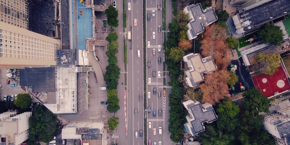 aerial view of cars on road near buildings during daytime