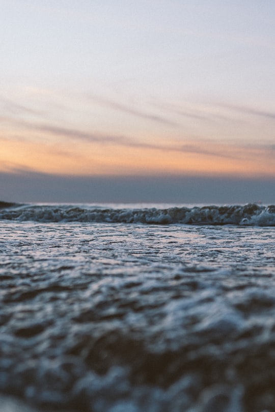 ocean waves crashing on shore during sunset in Riga Latvia