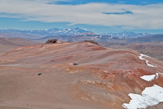 brown and gray mountains under white clouds and blue sky during daytime in San Juan Argentina