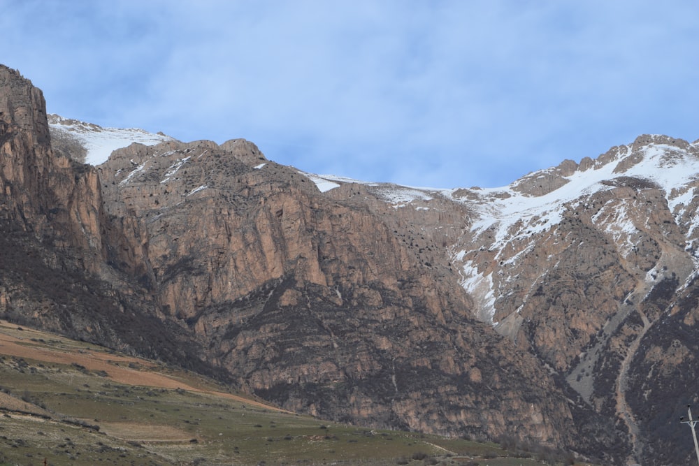 brown and white rocky mountain under blue sky during daytime