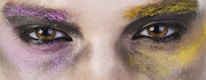 Close-up of a beautifully done graduation makeup with subtle purple eyeshadow.