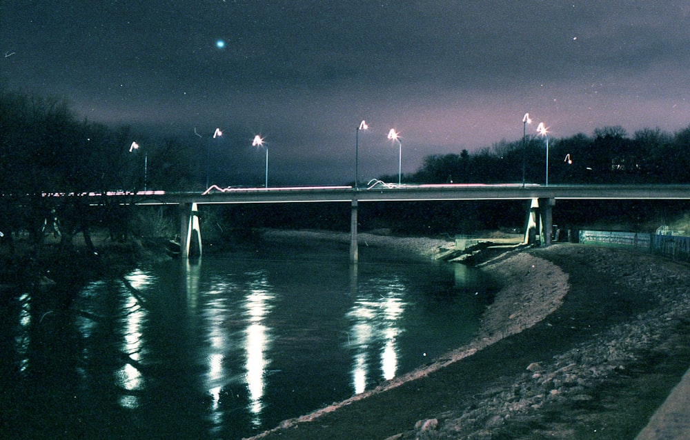 bridge over water during night time