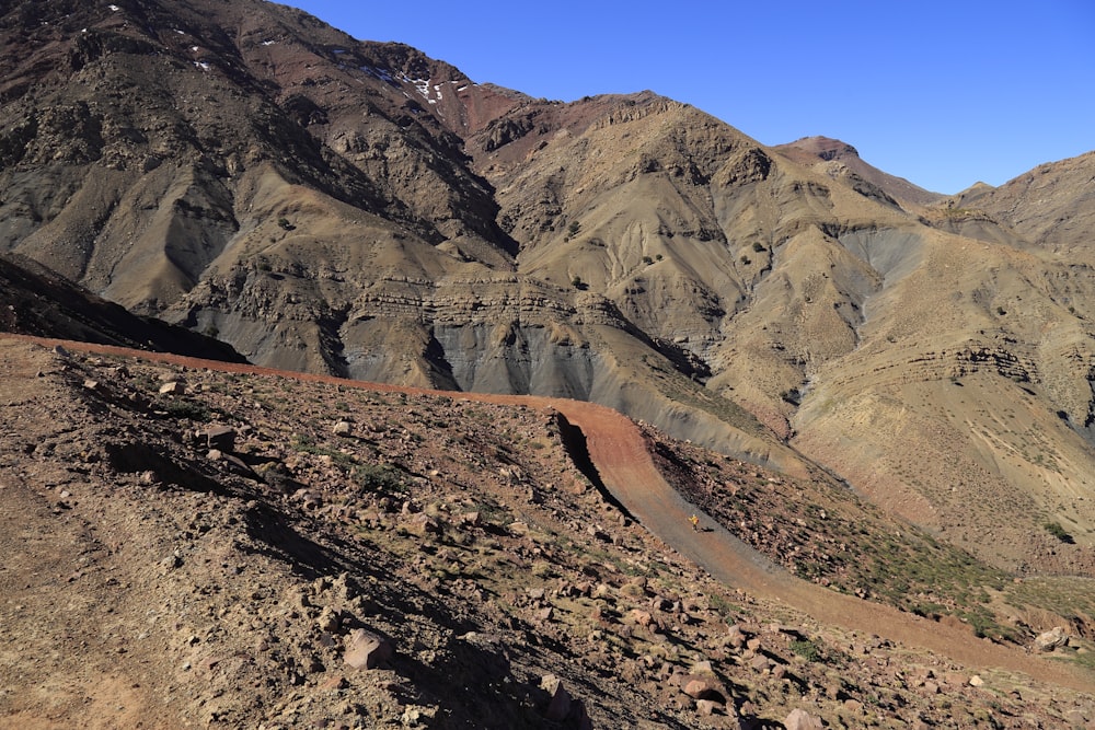 brown rocky mountain under blue sky during daytime