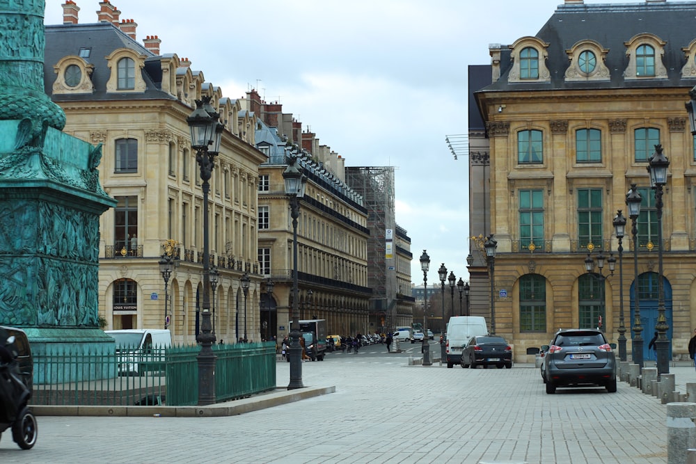 cars parked in front of brown concrete building during daytime