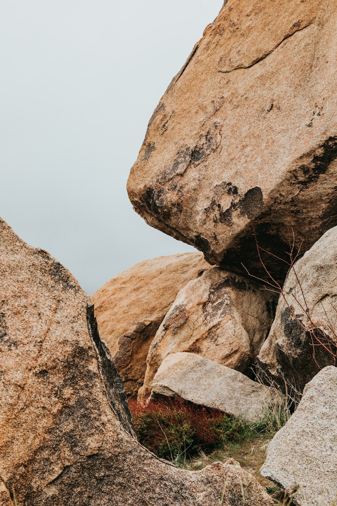 brown rock formation under white sky during daytime