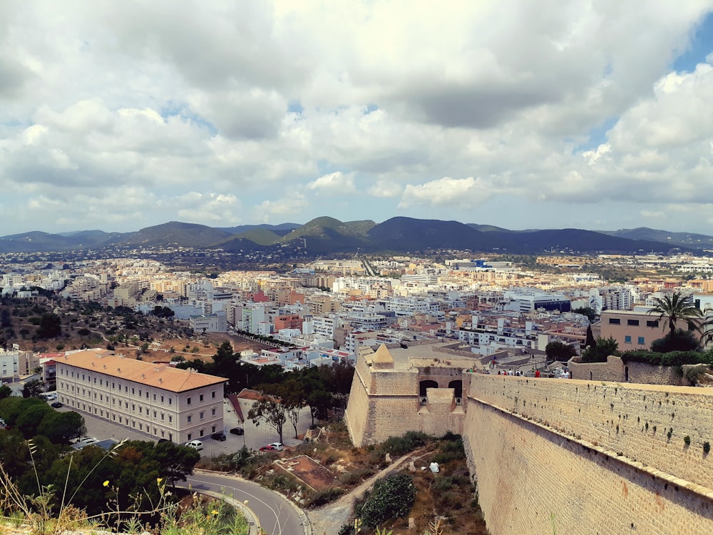 city with high rise buildings under white clouds during daytime, Dalt Villa, Ibiza