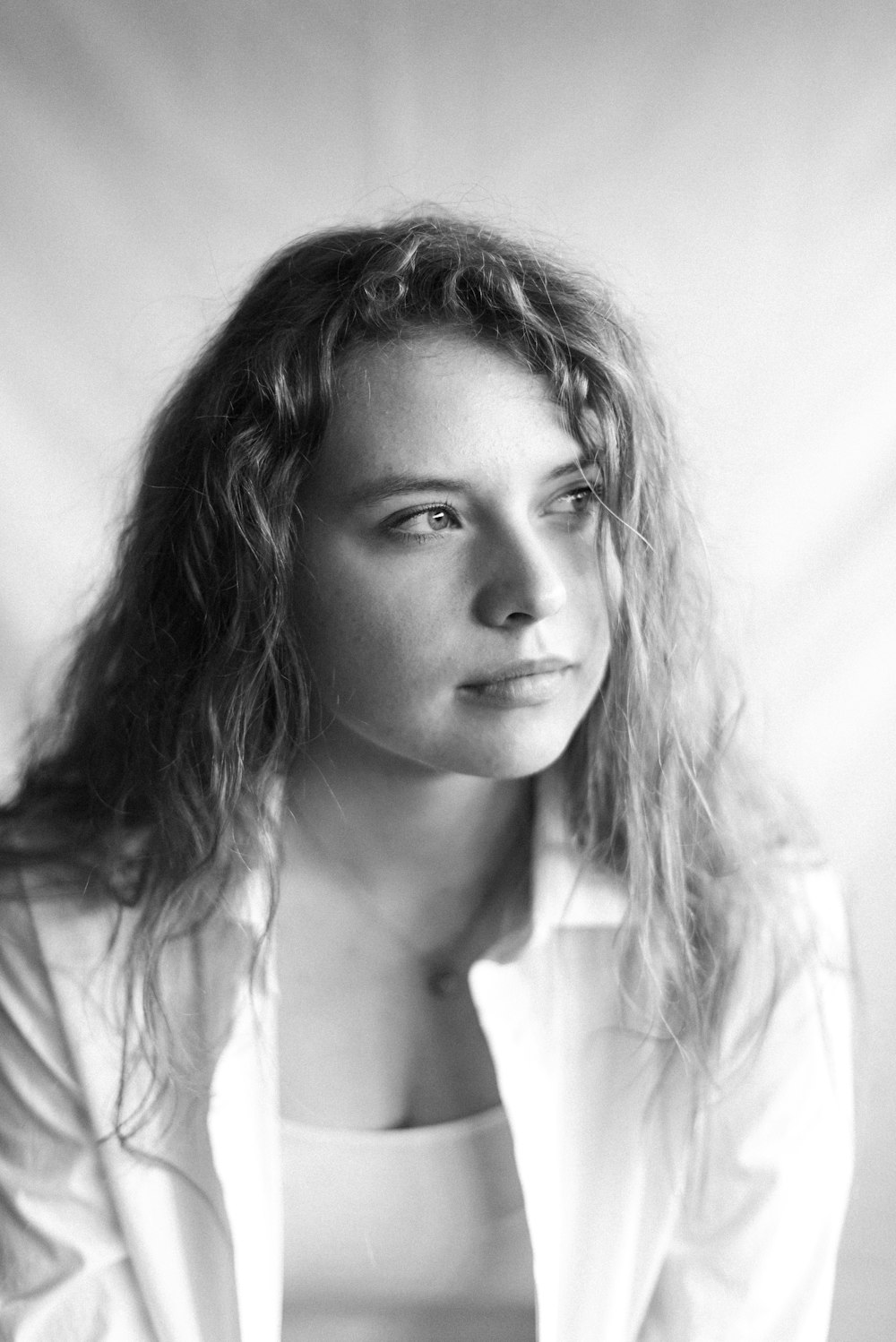 woman in white shirt in grayscale photography