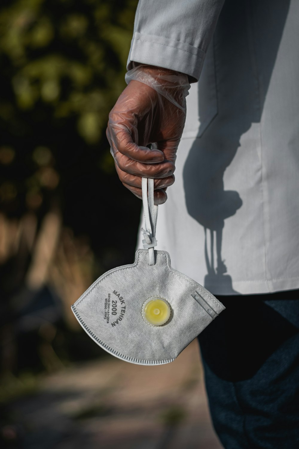 person holding silver and gold medal