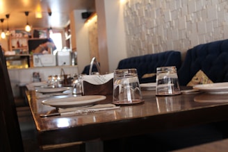 A warm, inviting dining area with rustic wooden tables and colorful soul food dishes beautifully plated.