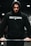 A person is wearing a black hoodie with the words 'Built Ready' printed on the chest. The individual appears to be lifting a barbell, focusing intently on the task.