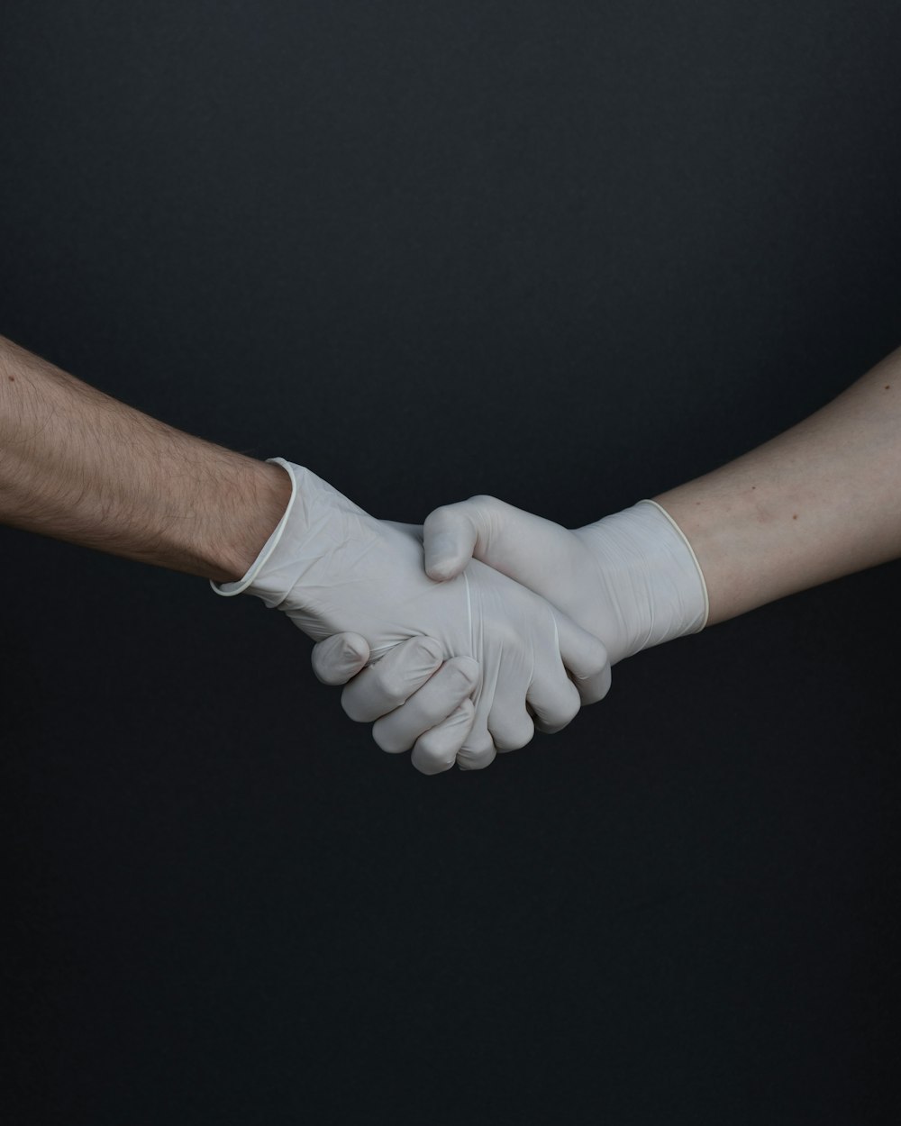 person holding white heart shaped paper