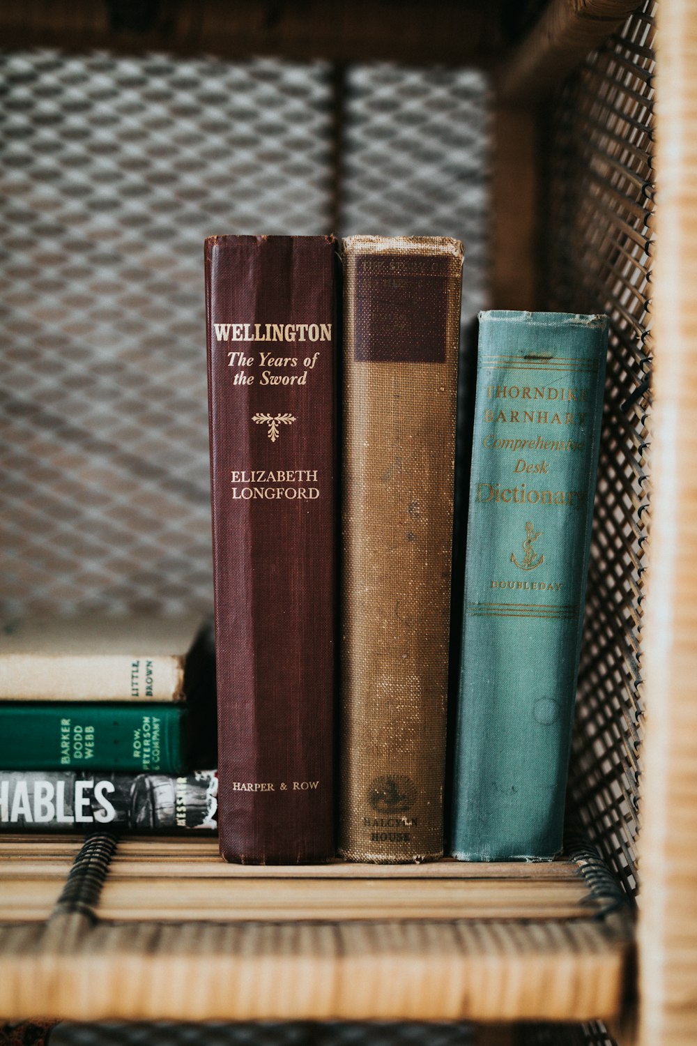 book collection on brown wooden shelf