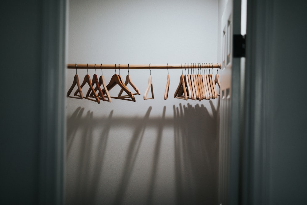 white and brown clothes hanger