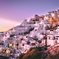 white concrete houses on hill during daytime