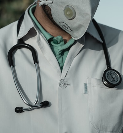 person in white and black stethoscope
