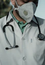person in white and black stethoscope