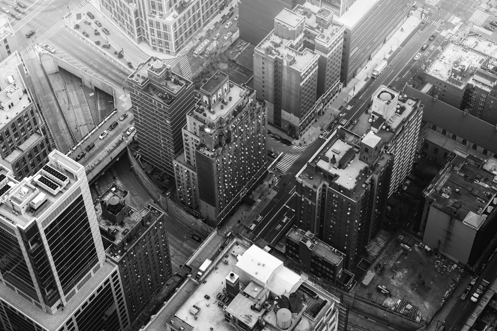 grayscale photo of city buildings