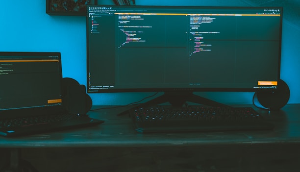 A sleek, dark-themed workspace with advanced sensors and monitors displaying industrial data.