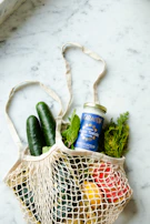 Graphene zipper bags stacked neatly beside a bowl of fresh produce, highlighting innovation.