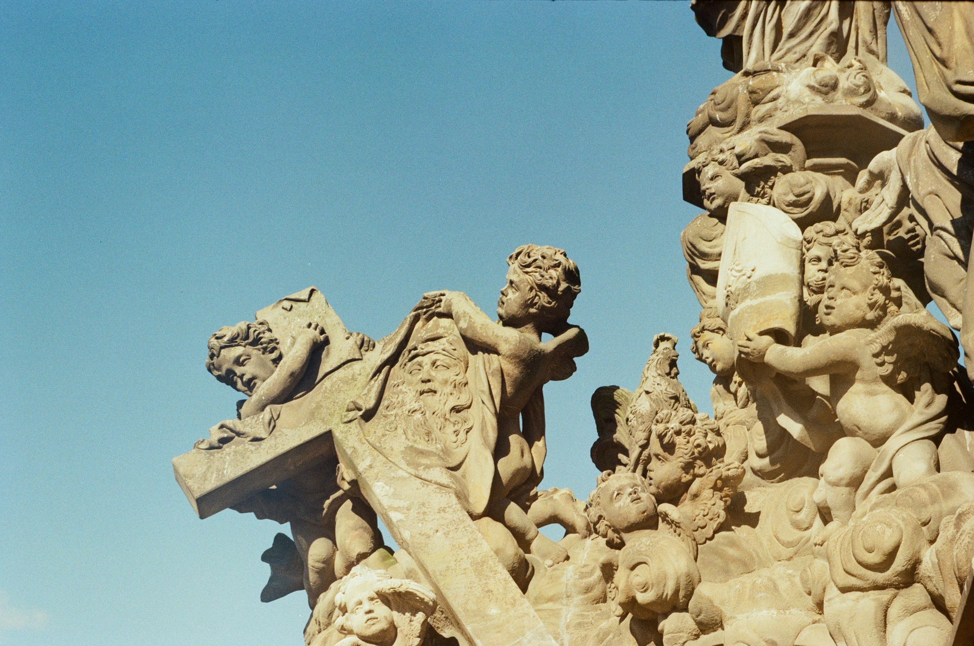 brown concrete statue under blue sky during daytime