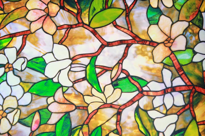 Close up picture of leadlight glass in a floral design.