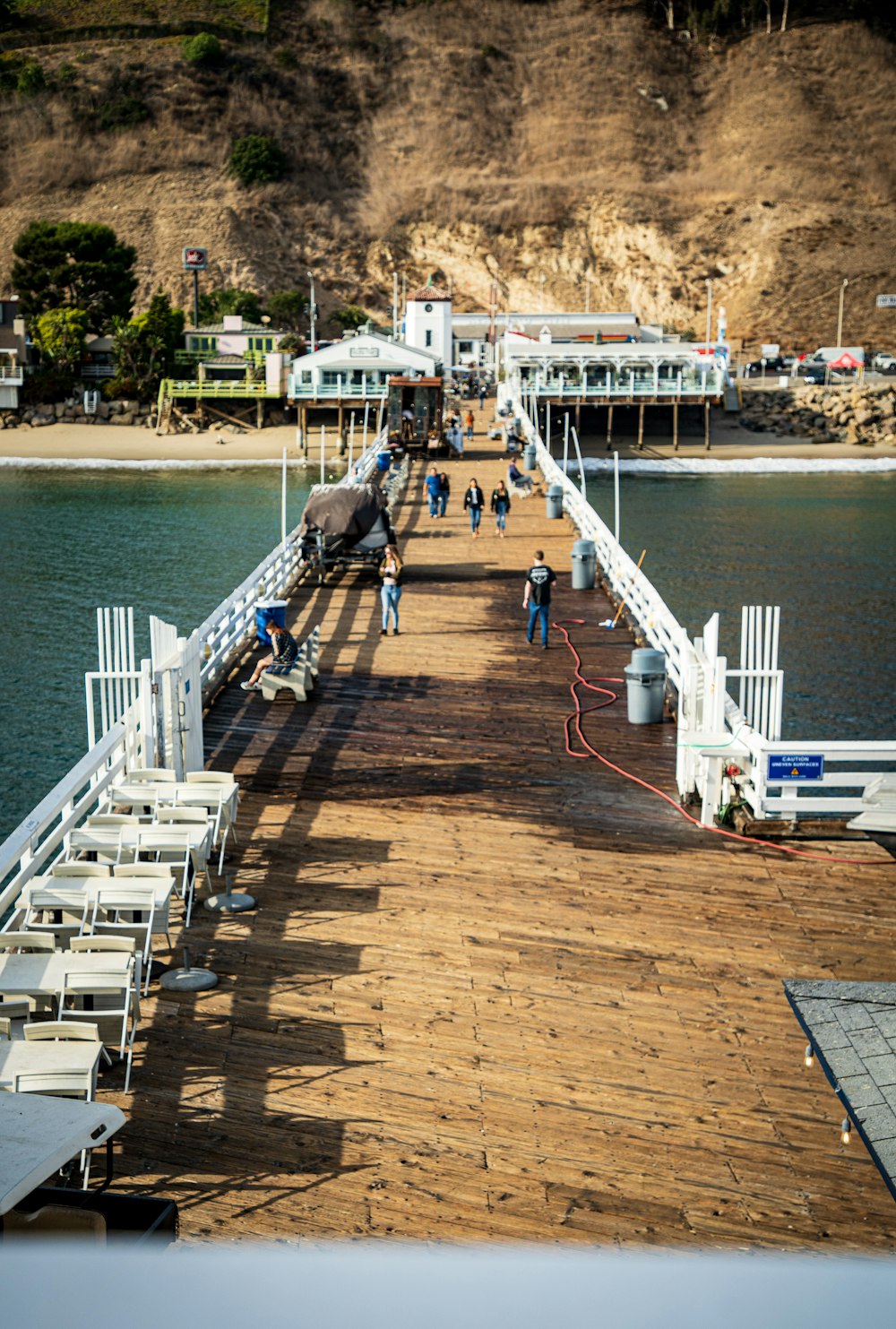 people walking on dock during daytime